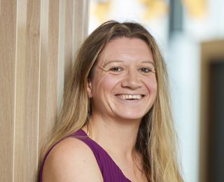 Woman looking into the camera and smiling