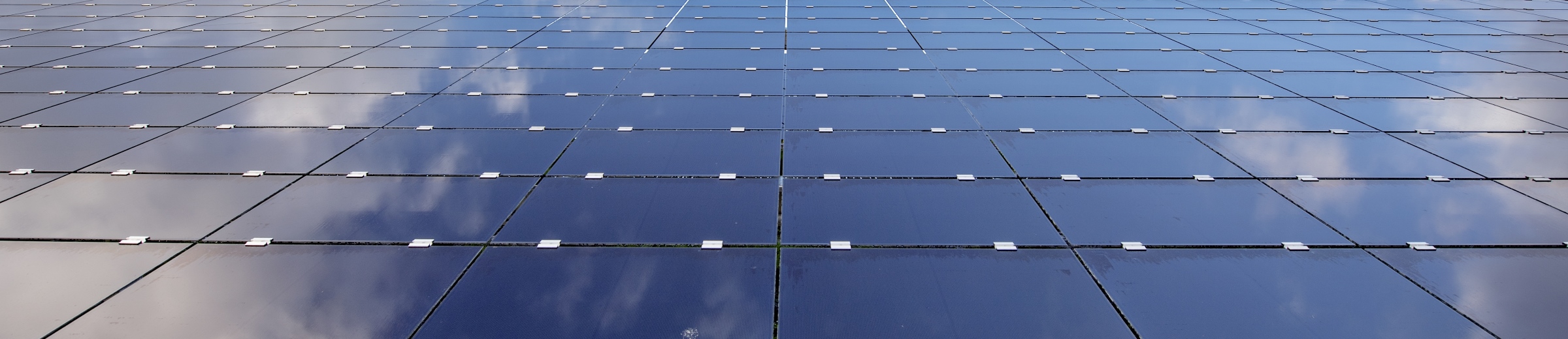 Solar panels reflecting sky